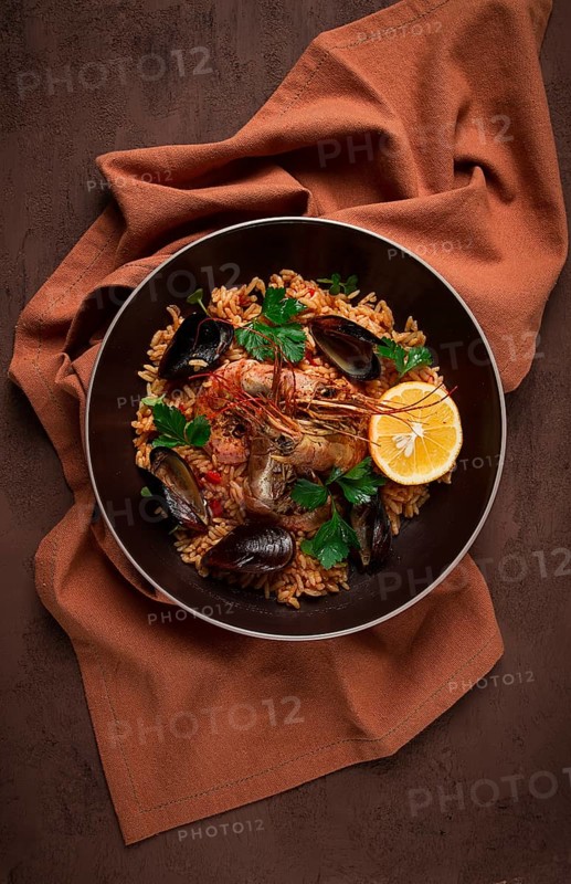 Seafood paella, shrimp and mussels risotto, rice, homemade, top view, no people
