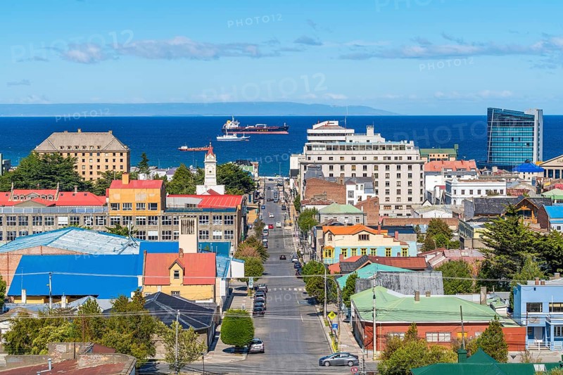 View from a hill over streets and houses to the Strait of Magellan, ships and a tanker in the background, city of Punta Arenas, Patagonia, Chile, South America