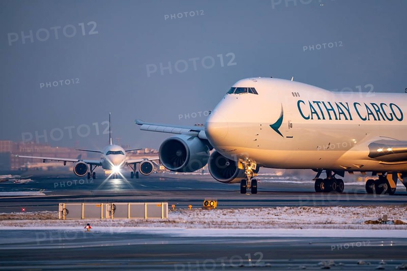 Aircraft on the taxiway to the western runway, Cathay Pacific Boeing 747F, freighter, Frankfurt Airport FRA, Fraport, in winter, Hesse, Germany, Europe