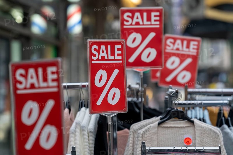 Sale, special offers of a clothing shop in the pedestrian zone, in Duisburg, North Rhine-Westphalia, Germany, Europe