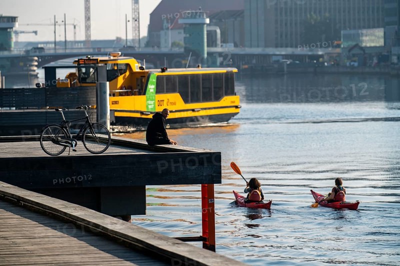 Water bus, kayaks in the harbour of Copenhagen, Denmark, Europe