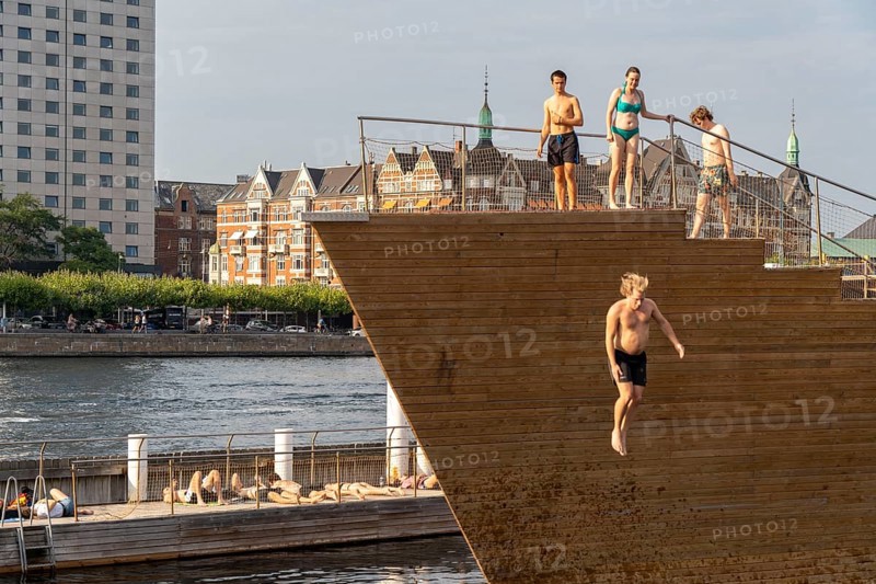 Summer, swimming in the harbour of Copenhagen, there are official bathing places, harbour baths and lidos in many places, here at Havnebadet Islands Brygge, Denmark, Europe