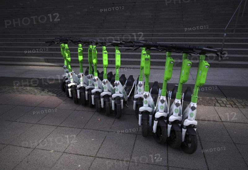 Several electric scooters parked at Lime, OnLime and Uber bike hire, Frankfurt am Main, Hesse, Germany, Europe