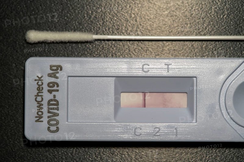 Covid-19 rapid test, antigen test, the abrasion of the swab is dissolved in a liquid and applied to the test device, after a few minutes the test device shows the result by a black line, whether the person has tested positive or negative, here a negative result