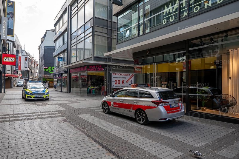 Effects of the coronavirus crisis, empty shopping street, patrol from the public order office and police, around 1400 hours on Saturday, normally thousands of people go shopping here at this time, Hohe Straße in Cologne, Germany, Europe