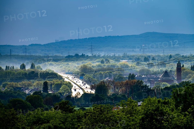 View from the Rungenberghalde, Gelsenkirchen to the west, after a rain shower, green landscape, motorway A2, in the background the slagheap Haniel in Bottrop, North Rhine-Westphalia, Germany, Europe