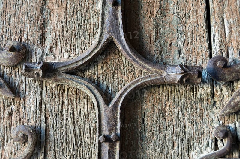Orcival. Intricate Roman wrought iron hinge displayed at the Basilica Notre-Dame d'Orcival, Puy de dome, Auvergne-Rhone-Alpes, France, Europe