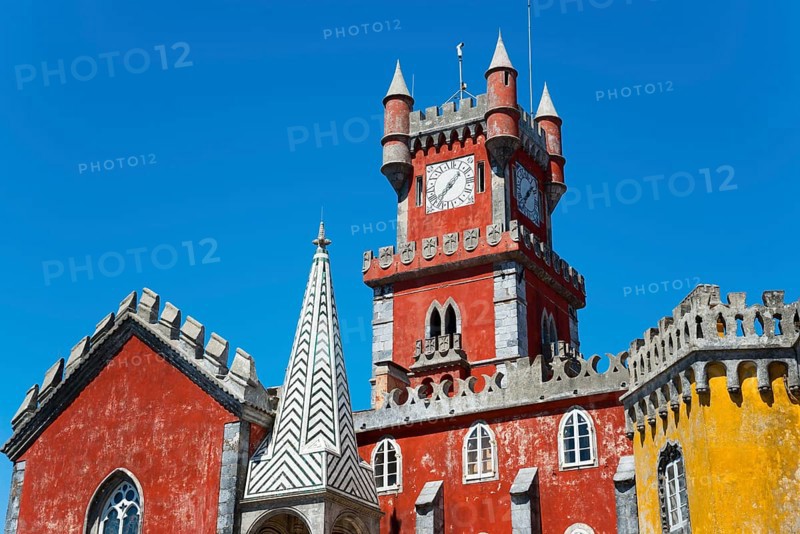 Red tower with clock and architectural decorations under a blue sky, detail, Palácio Nacional da Pena, Pena National Palace, Sintra, Lisbon, World Heritage Site, UNESCO, Portugal, Europe