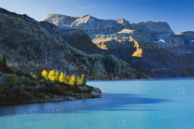 Autumn colours at Lac d'Emosson in the Valais mountains with Pic de Tenneverge in the background, Switzerland, Europe