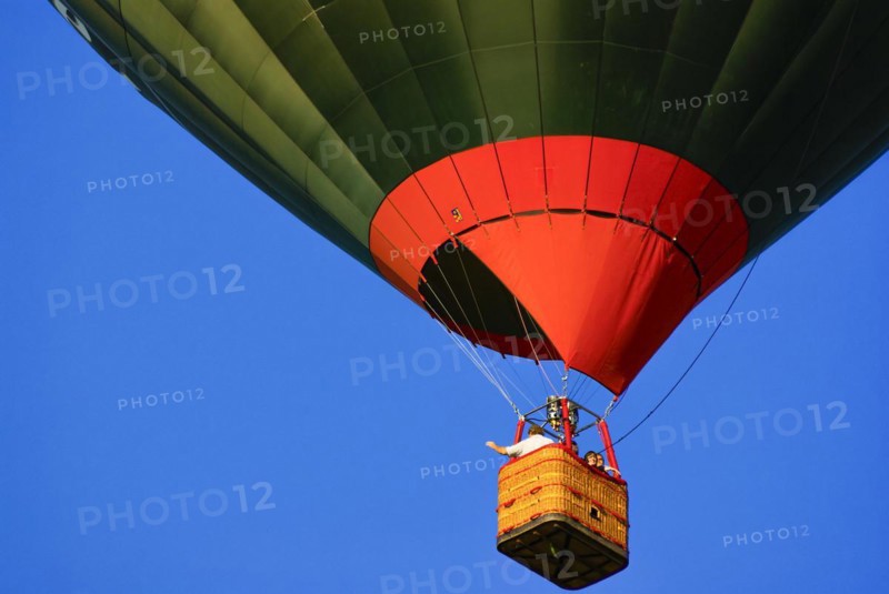A hot air balloon rises into the air with passengers on board, as part of the aviation festival on the Rossfeld in Metzingen-Glems, Metzingen, Baden-Württemberg, Germany, 11 September 2010, for editorial use only, Europe