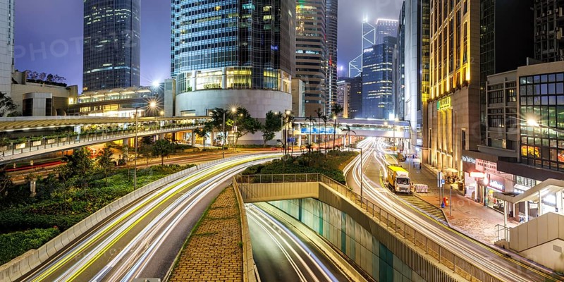 Traffic with streets and skyscrapers in the city of Hong Kong Panorama at night in Hong Kong, China, Asia