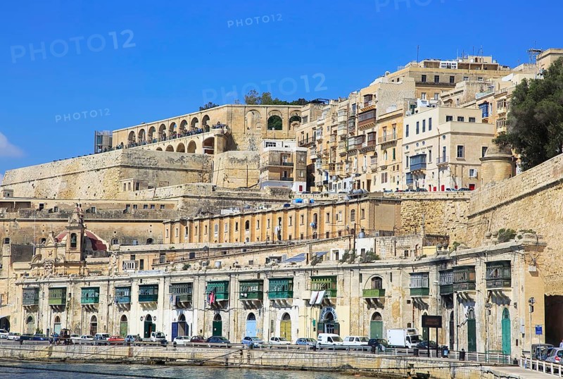 Historic waterfront buildings on Grand Harbour waterside, Valletta, Malta, Europe