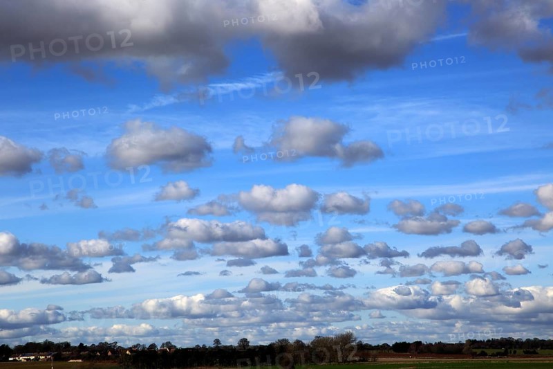Cumulus clouds in blue sky over Bawdsey and Alderton, Suffolk, England, UK
