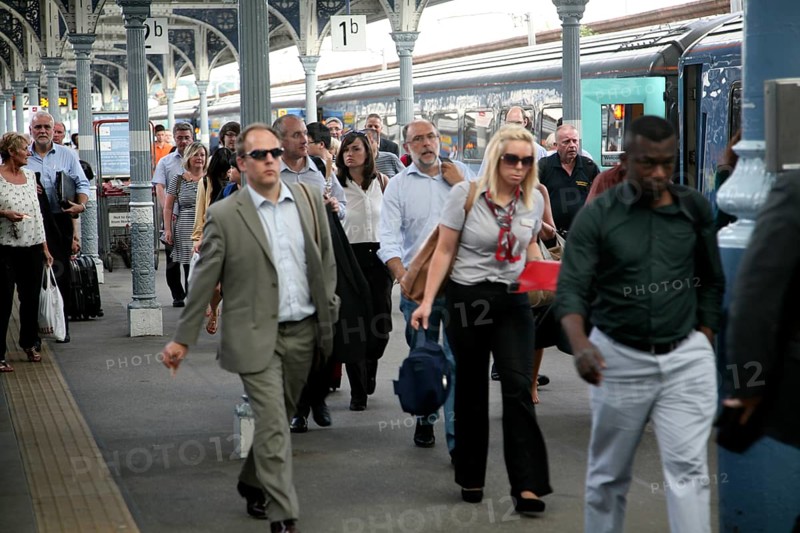 Crowd of passengers leaving their trains on the platform at Norwich railway station, Norfolk, England, United Kingdom, Europe