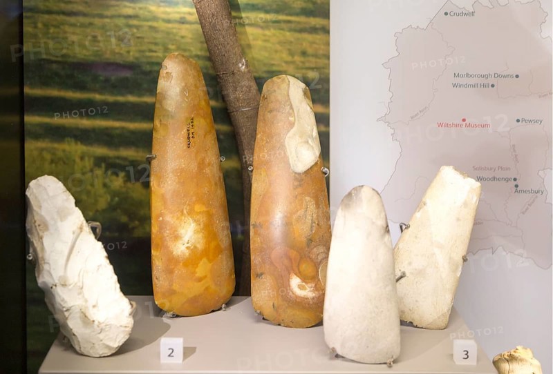 Close up of neolithic axes in display case. With permission of Wiltshire Museum, Devizes, England, UK