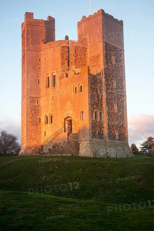 Late afternoon winter sunshine shining on walls of Orford Castle, Orford, Suffolk, England, United Kingdom, Europe