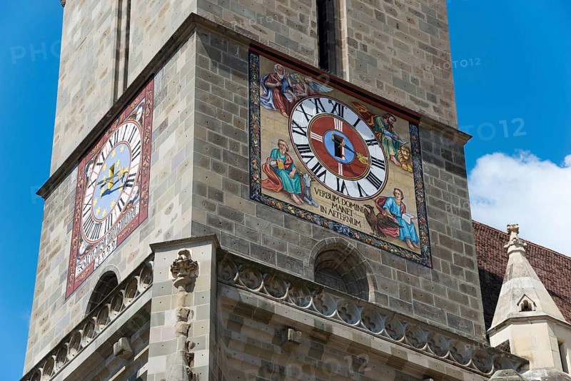 Close-up of a church tower with a large clock and colourful frescoes, Black Church, Old Town, Brasov, Brasov, Transylvania, Romania, Europe