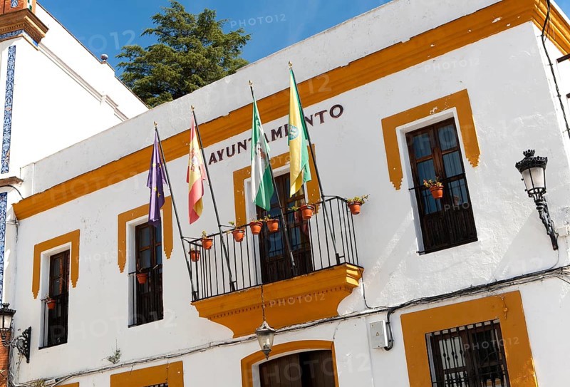 Ayuntamiento town hall building with flags in village of Alajar, Sierra de Aracena, Huelva province, Spain, Europe