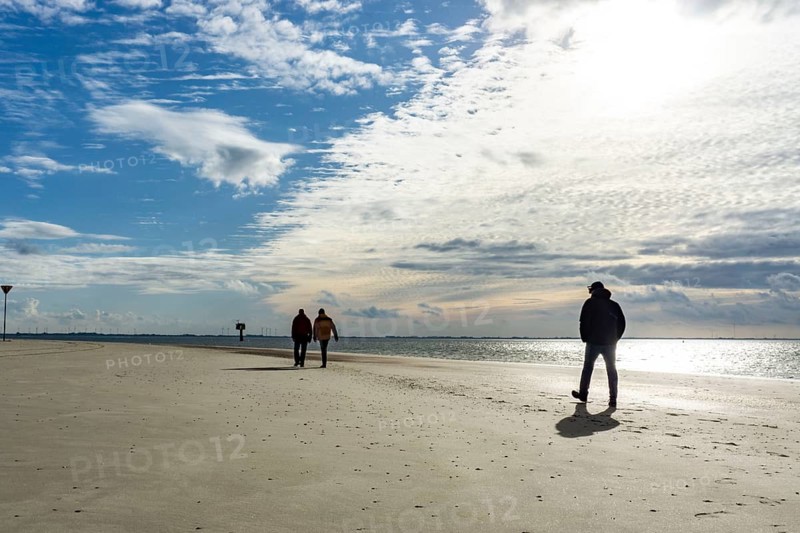 North Sea, Spiekeroog Island, autumn, strong wind drives the sand over the mudflats at low tide, beach walker, west coast of the East Frisian Island, Lower Saxony, Germany, Europe