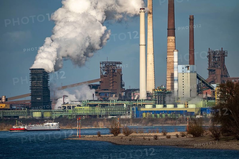 Rhine at Duisburg Bruckhausen, Marxloh, Thyssenkrupp Steel steelworks, blast furnaces, sintering plant, discharge cloud of the Schwelgern coking plant, cargo ships, Duisburg, North Rhine-Westphalia, Germany, Europe