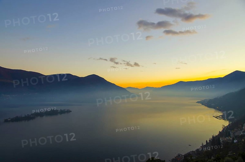 Aerial View over Alpine Lake Maggiore with Fog in twilight with Brissago Islands and Mountain in Brissago, Ticino, Switzerland, Europe