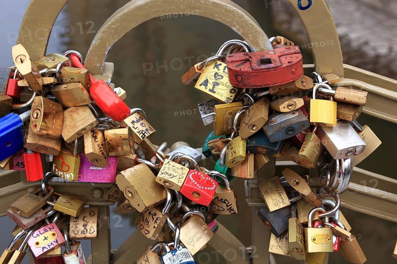 Lover's lock on a railing, love lock is a padlock which, according to custom, is attached to bridges by lovers to symbolically seal their eternal love, Prague, Czech Republic, Europe