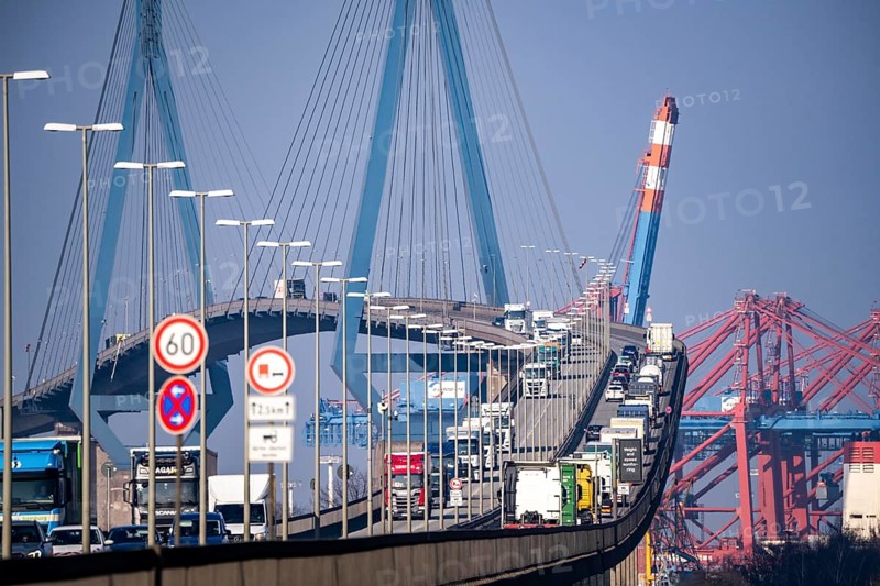 Traffic on the Köhlbrand Bridge in the port of Hamburg, spans the 325 m wide Köhlbrand, an arm of the Süderelbe, the bridge is over 3600 metres long, 53 metres above the water, piers 135 m high, more than 30, 000 vehicles use the B3 bridge daily, important connection to the port, it is dilapidated, to be rebuilt, Hamburg, Germany, Europe
