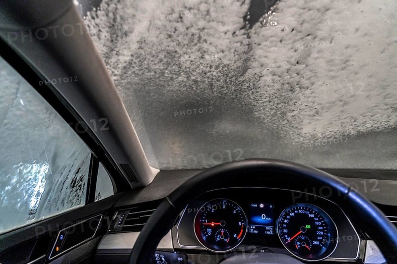 Car in an automatic car wash, car wash tunnel
