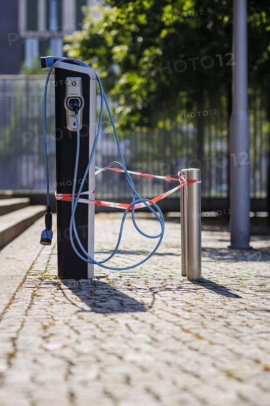 Symbol photo on the topic 'Äô Problems with electromobility 'Äô. A charging station for electric cars is wrapped in barrier tape and cannot be used. Berlin, 14.08.2024