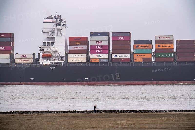 Thick fog in winter, hanging over the mouth of the Elbe into the North Sea, container ship NYK Venus, entering the Lower Elbe, Cuxhaven, Lower Saxony, Germany, Europe