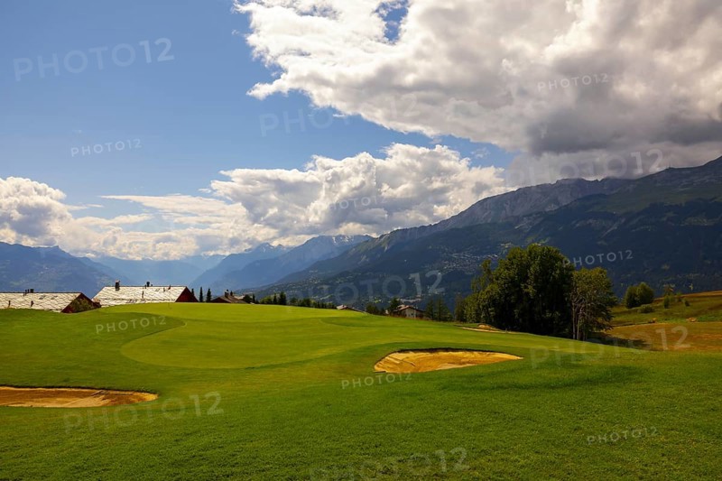 Crans Sur Sierre Golf Course with Hole 7 and Mountain View in Crans Montana in Valais, Switzerland, Europe