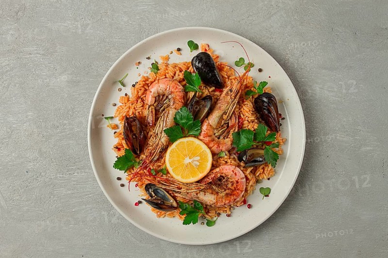 Seafood paella, shrimp and mussels risotto, rice, homemade, top view, no people