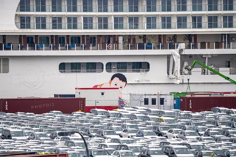 Parking space for import vehicles, hundreds of Hyundai Ioniq, electric cars, waiting for onward transport, cruise ship World Dream, Manara, at the EUROGATE container terminal in the overseas port of Bremerhaven, Lower Saxony, Germany, Europe