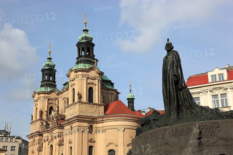 Jan Hus Monument on Old Town Square and the baroque St Nicholas Church, Prague, Czech Republic, Europe