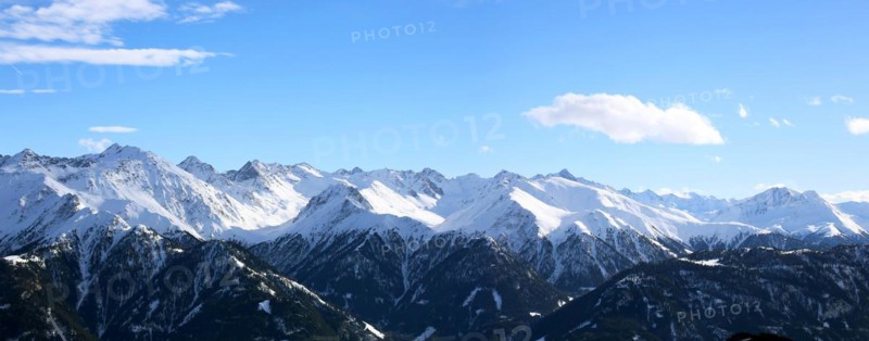 Alpine panorama with snow-covered mountain peaks in winter. Taken in the ski resort of Serfaus Fiss Ladis (Tyrol, Austria)