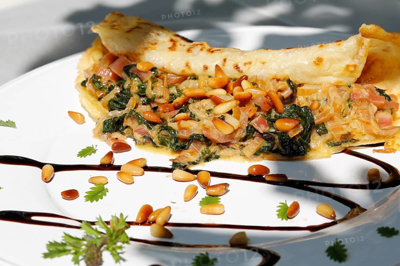 Swabian cuisine, stuffed pancakes with chard and pine nuts, vegetarian, hearty, savoury, typical Swabian reinterpreted, home cooking, vegetables, healthy, pan-fried dish, main course, plate, traditional cuisine, food photography, studio, Germany, Europe