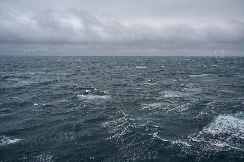 A stormy and turbulent sea under a cloudy grey sky, North Sea, Norway, Europe