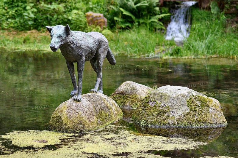 Heidelberg, Germany, June 8th 2024: Wolf sculpture at historic well called 'Wolfsbrunnen' in Heidelberg-Schlierbach, Europe