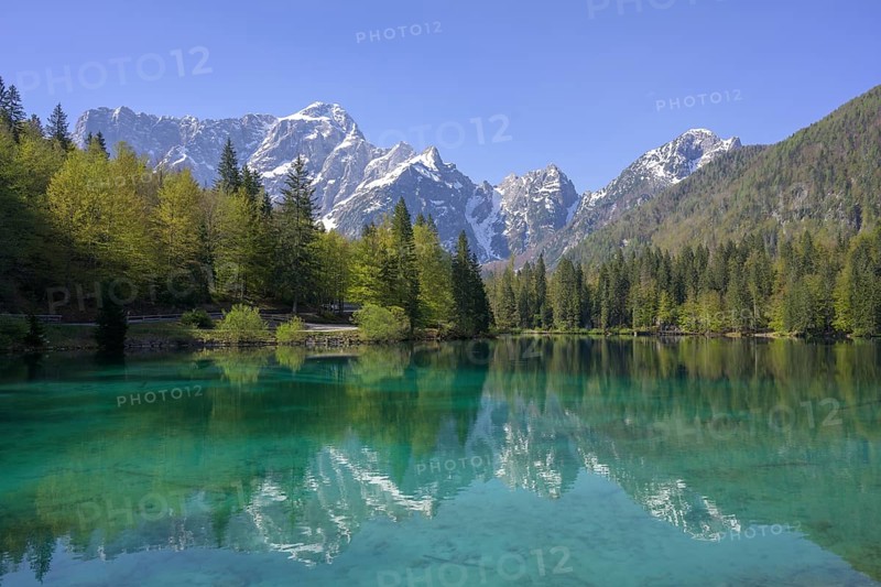 Mangart mountain range reflected in the lower Fusine Lake, Tarvisio, province of Udine, Italy, Europe