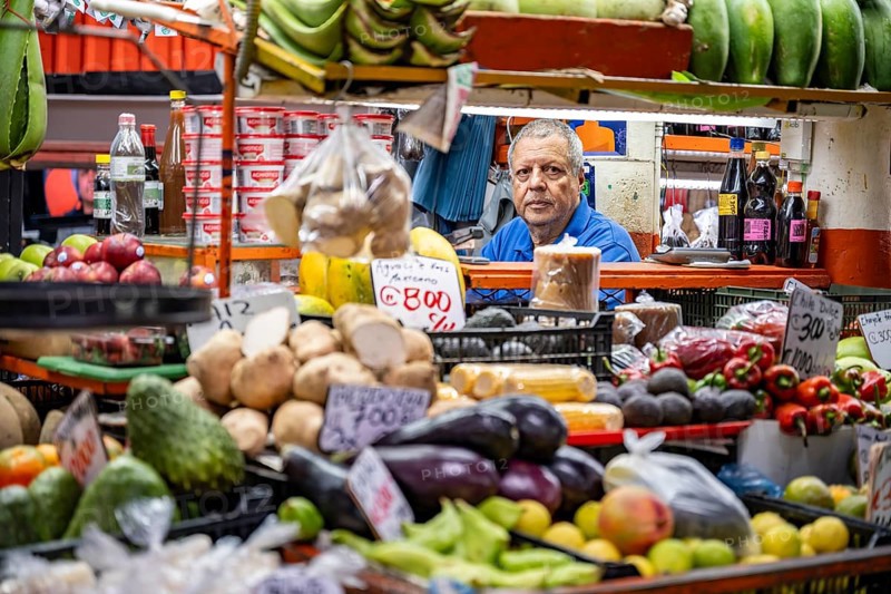 Vendor and display of fruit and vegetables at a market stall, Mercado Central de San José, San José, Costa Rica, Central America