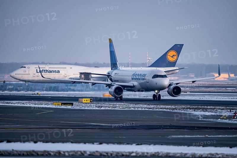 Lufthansa Boeing 747-8, Discover Airbus A320-200, on the way to Runway West, Frankfurt FRA Airport, Fraport, in winter, Hesse, Germany, Europe