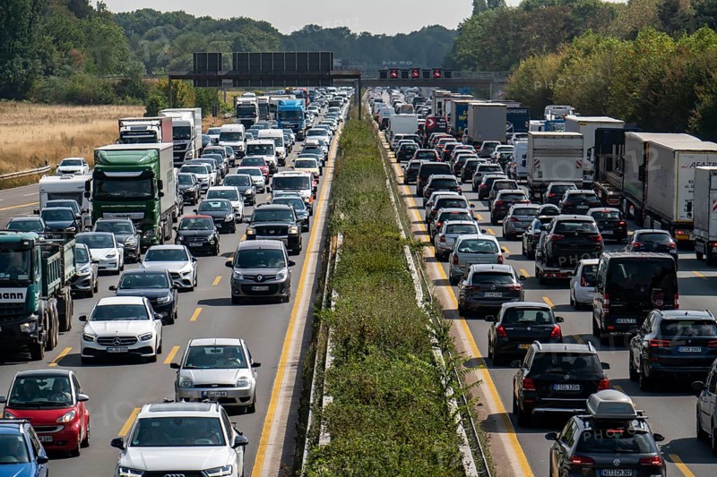 Traffic jam on the A3 motorway, over 8 lanes, in both directions, between the Leverkusen motorway junction and the Cologne-Mülheim junction, looking south, Friday afternoon heavy traffic, delays due to the traffic jam, Leverkusen, North Rhine-Westphalia, Germany, Europe
