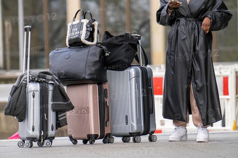 Travellers with luggage, suitcases on a platform, North Rhine-Westphalia, Germany, Europe