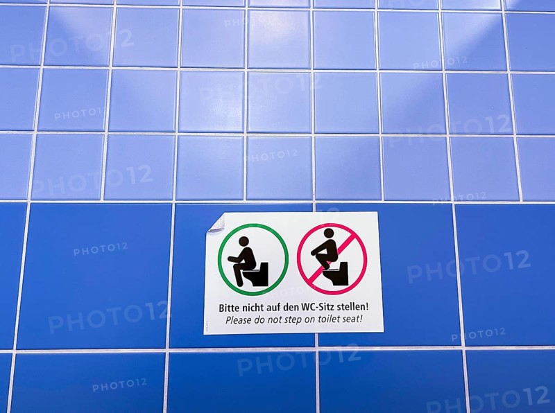 Sign in a public toilet, do not place on the toilet seat