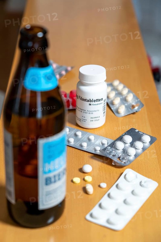 Symbolic image of alcohol and medication, you should not take medicine, pills, tablets with alcohol, the effect is intensified or the medicine does not work properly