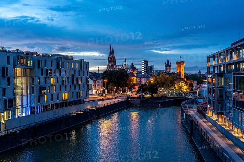 Skyline with Cologne Cathedral, Gross St. Martin Catholic Church, Malakoff Tower, Rheinauenhafen harbour, art'otel cologne on the left, sunset, Rhine, Cologne, North Rhine-Westphalia, Germany, Europe