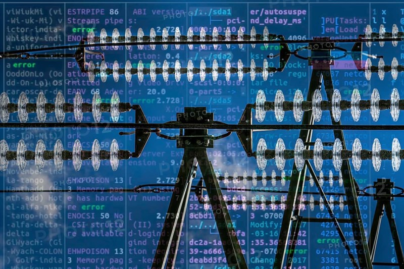 Symbolic image Critical infrastructure, blackout risk, cyberterrorism, insulators made of glass on a high-voltage line, hanging on the pylons as a suspension device between the pylon and the live, uninsulated cable, extra-high voltage line, symbolic image energy