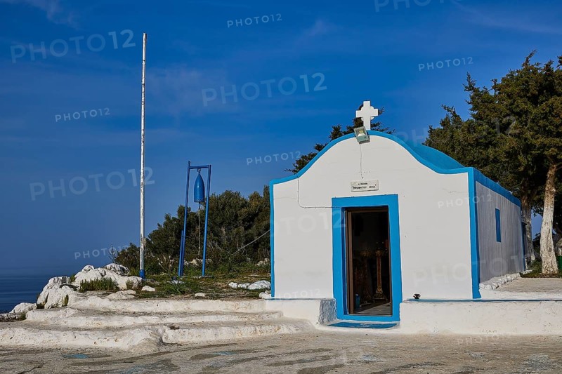 Profitis Ilias Chapel, White chapel with blue accents, surrounded by trees under a blue sky, Anthony Quinn Bay, Vagies Bay, Rhodes, Dodecanese, Greek Islands, Greece, Europe