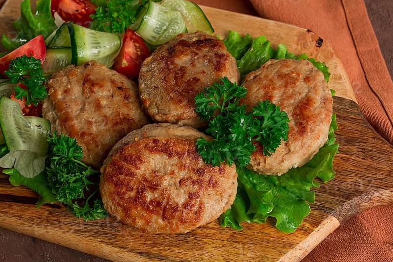 Fried cutlets, turkey, with vegetable salad, top view, no people