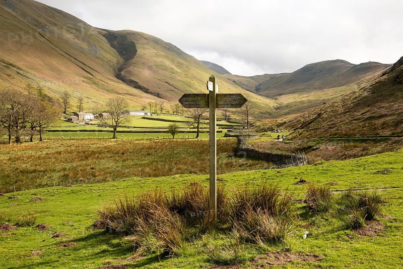 Wooden footpath pointer signpost at Fusedale, Howtown, Lake District national park, Cumbria, England, UK